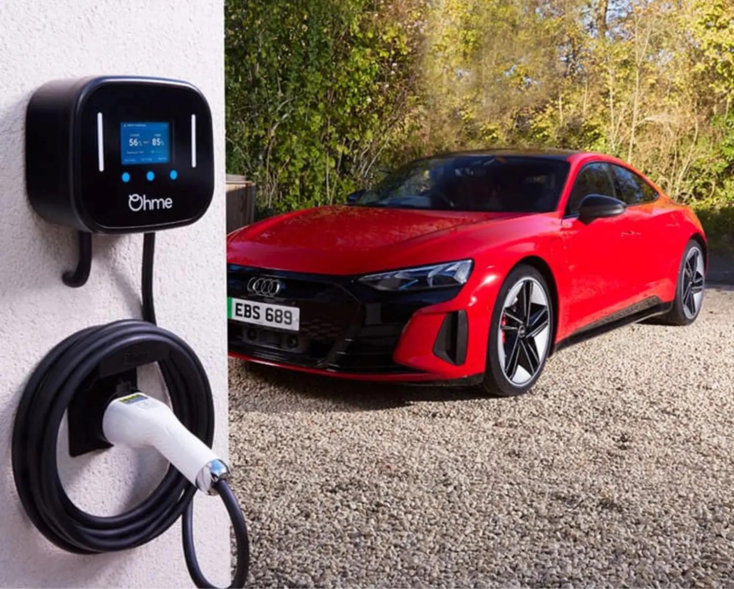 Audi A5 Saloon, in red, parked on driveway with Ohme Electric Charger installed