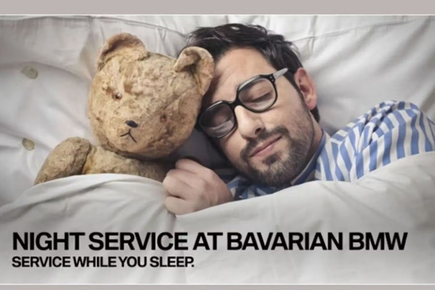 Man sleeping in bed while his car is being serviced at Bavarian BMW.