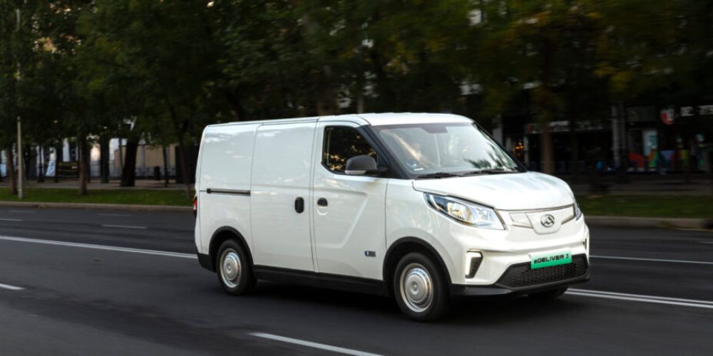 White Maxus van driving shot