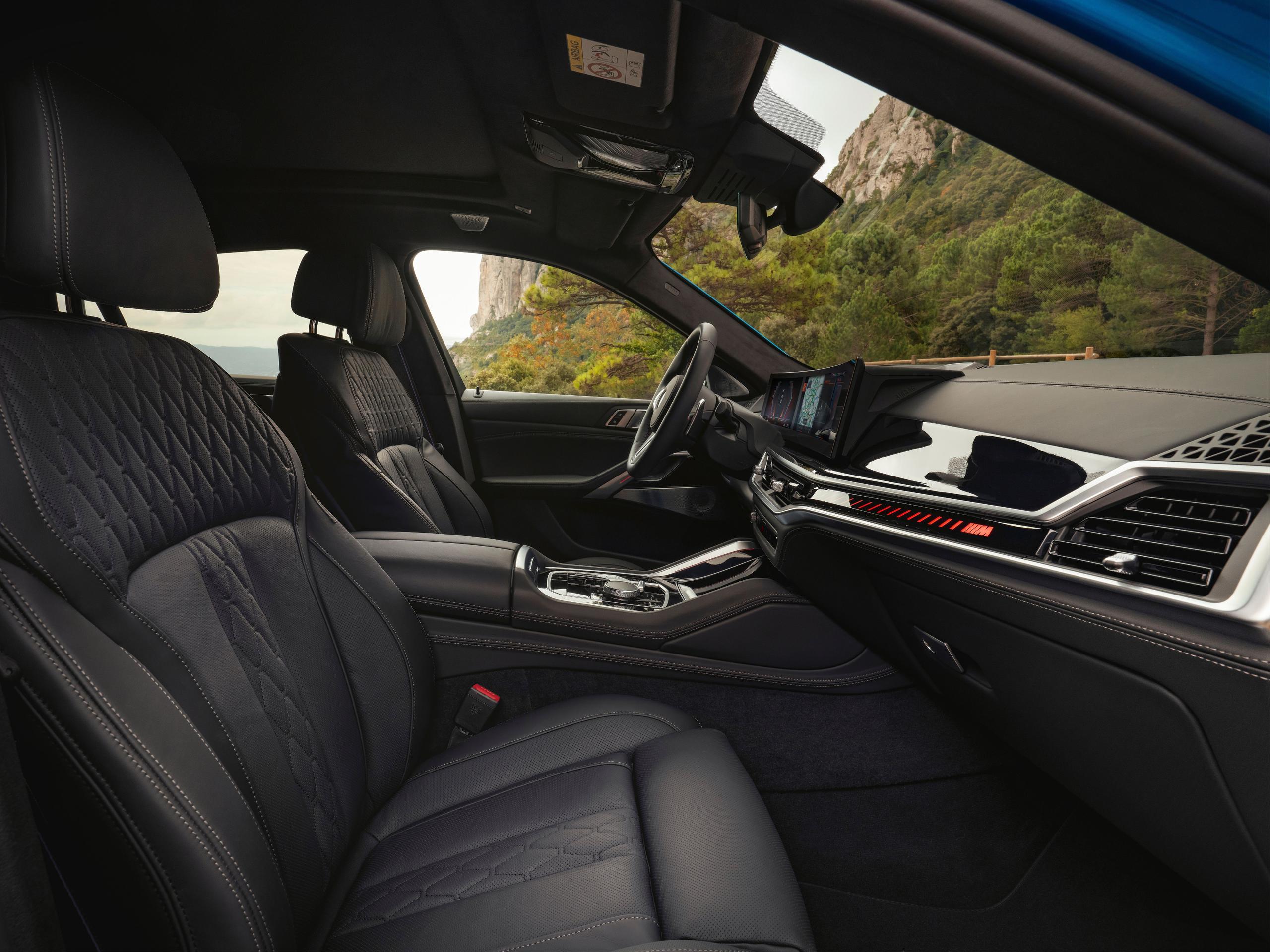 Interior view of new BMW X6, close-up of the front interior design and dashboard