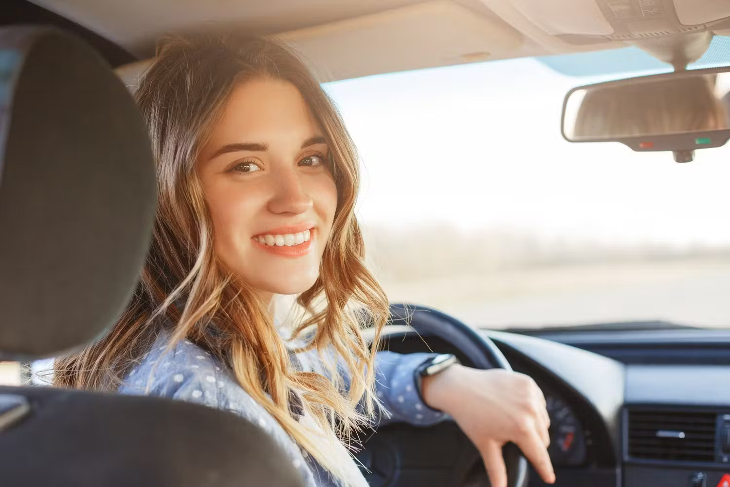 woman looking back in a vehicle