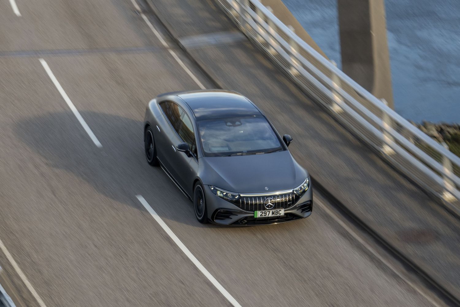 Grey EQS Saloon driving on the highway.