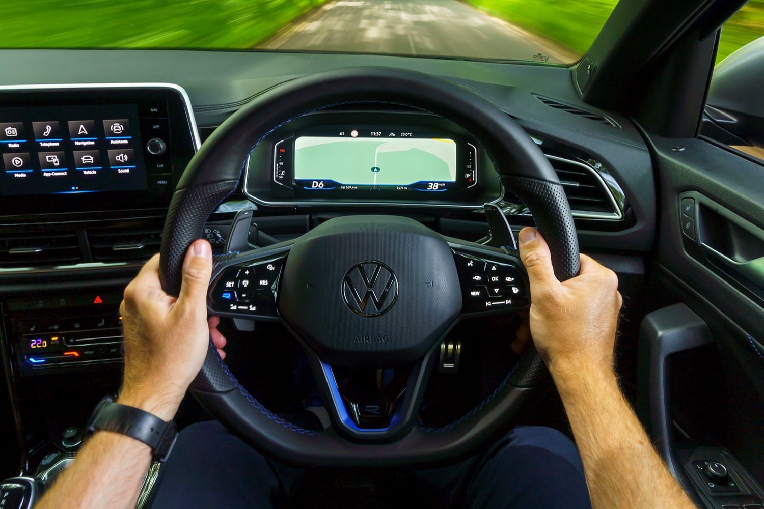 First-person view of the new Volkswagen T-Roc being driven by driver on country road
