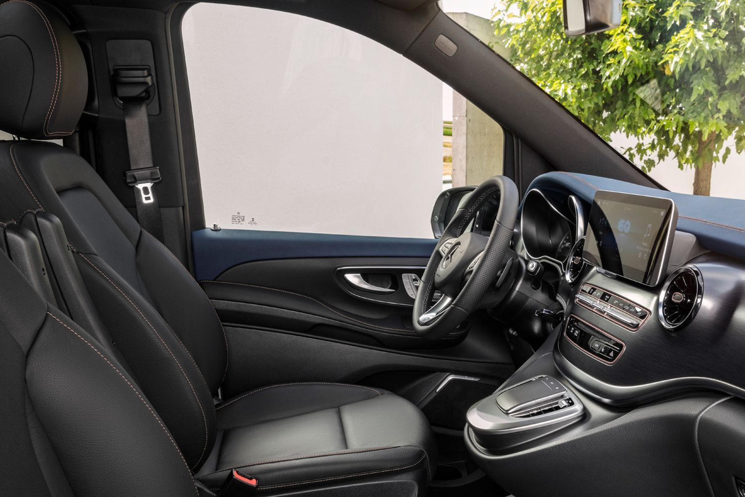 Mercedes-Benz black interior seats, steering wheel and drivers display.