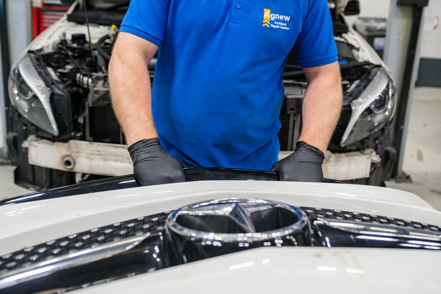 Agnew Repair Centre Specialist checks the front grill of a Mercedes-Benz A-Class for a small to medium area technology repair