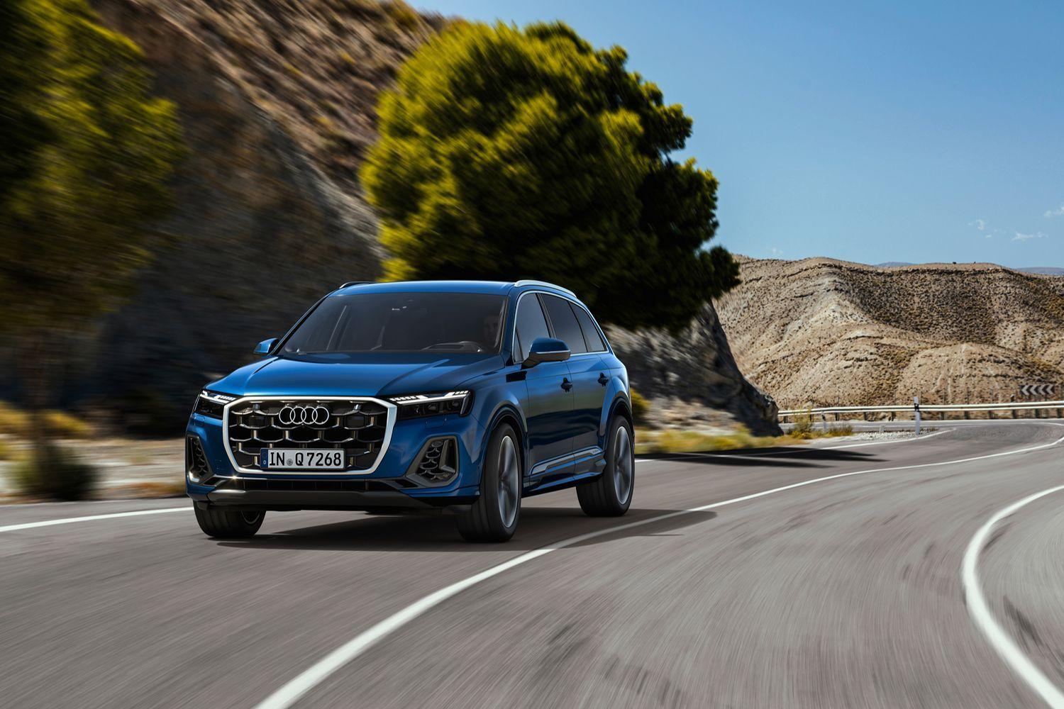 All-new Audi Q7 in blue, drives along desert road