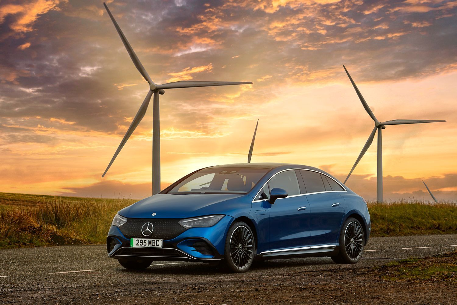 Blue Mercedes-Benz EQE Saloon side view.