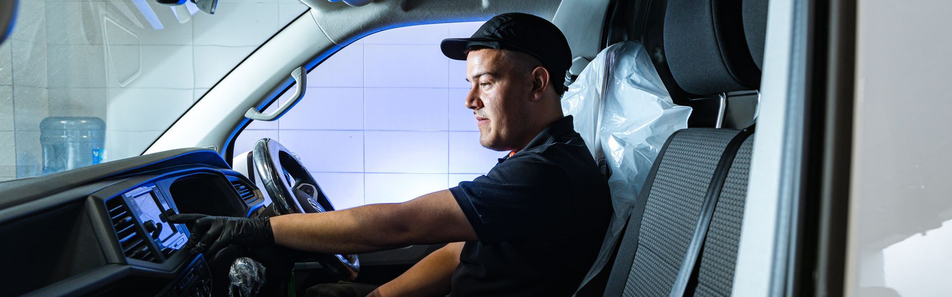 Volkswagen Technician inspects the inside of van during repair at Agnew Van Centre