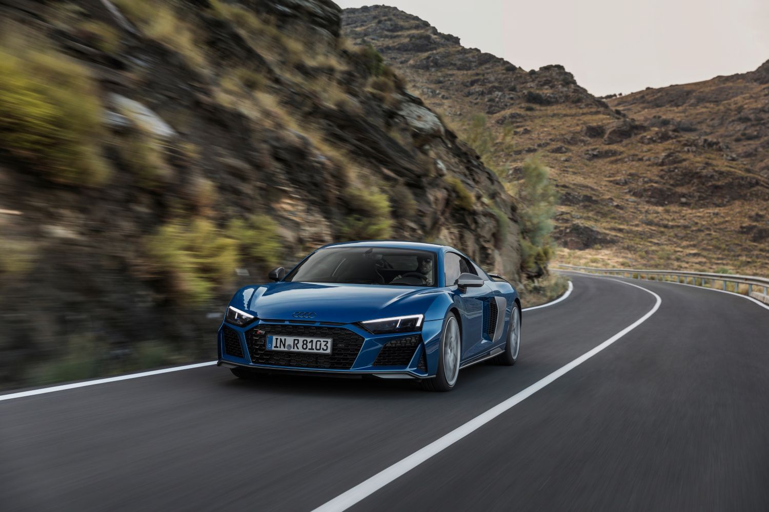 New Audi R8 Coupe in blue, image of vehicle from the front driving
