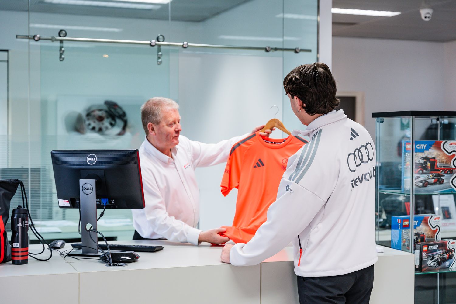 Customer looks at the latest range of accessories & merchandise available at Belfast and Portadown Audi