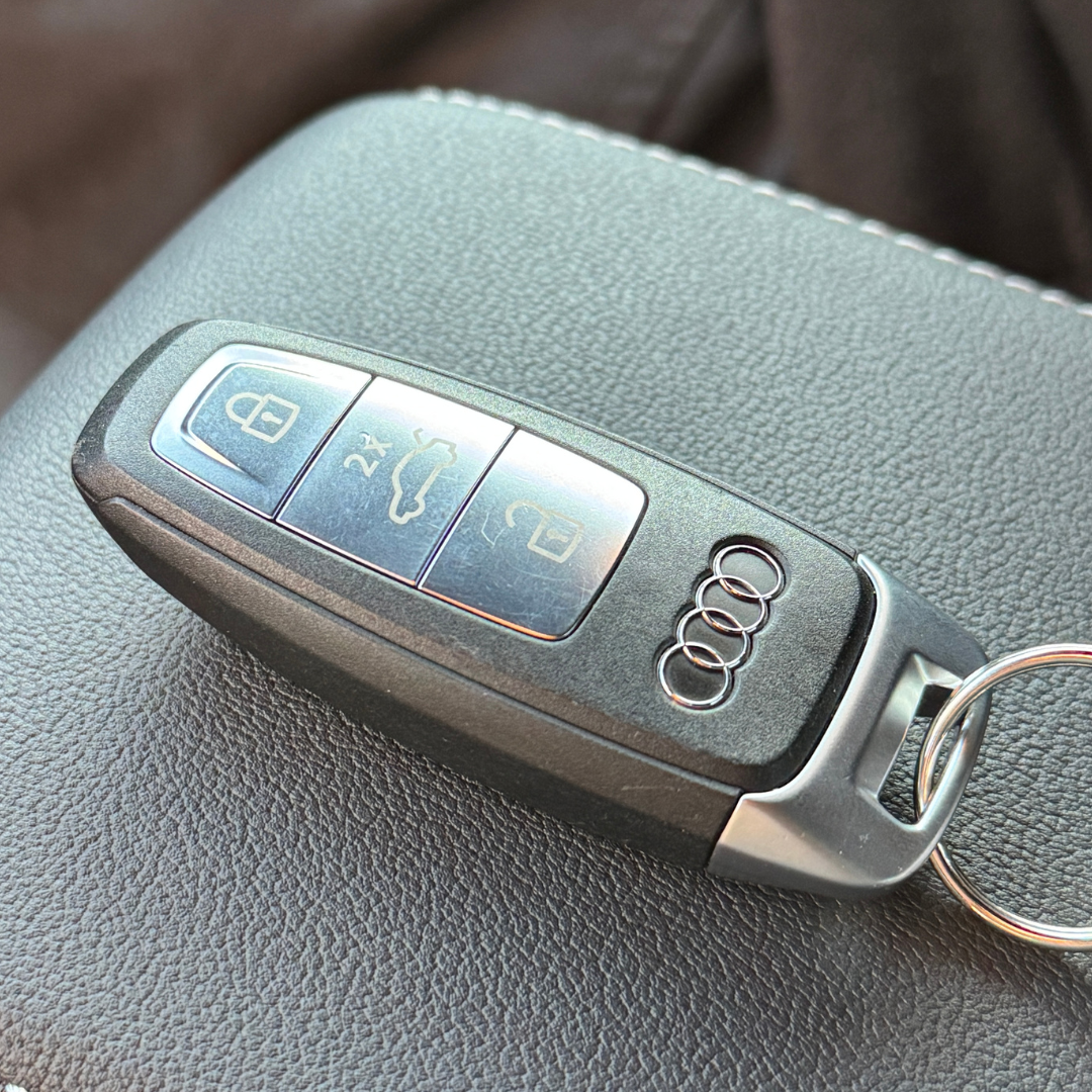 Close up of an Audi vehicle key.