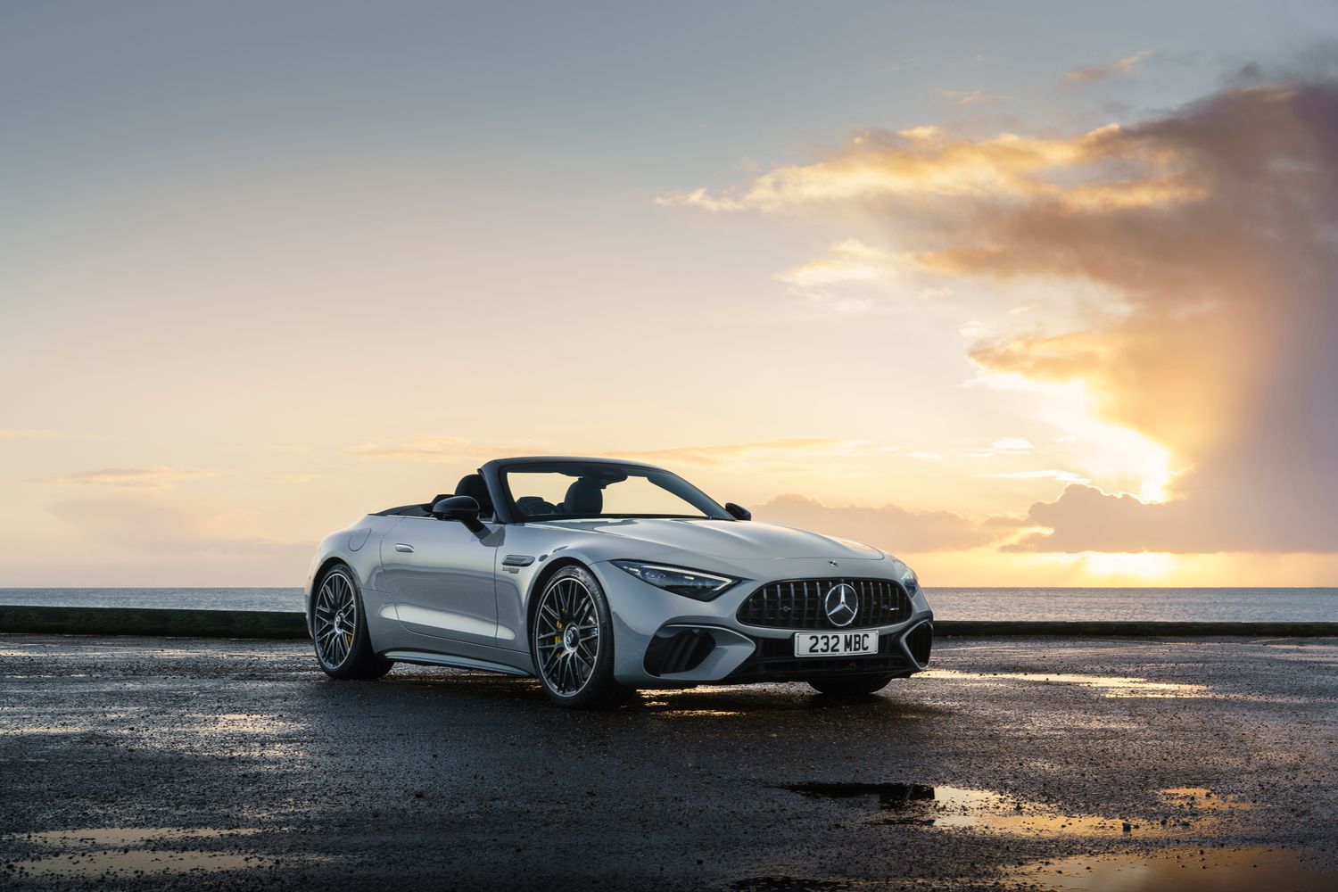 Side view of a Mercedes-Benz SL parked beside the sea.