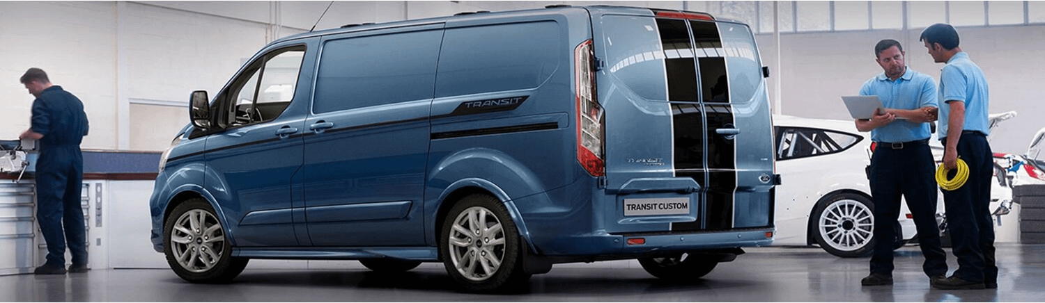 Ford Transit in a garage with engineers