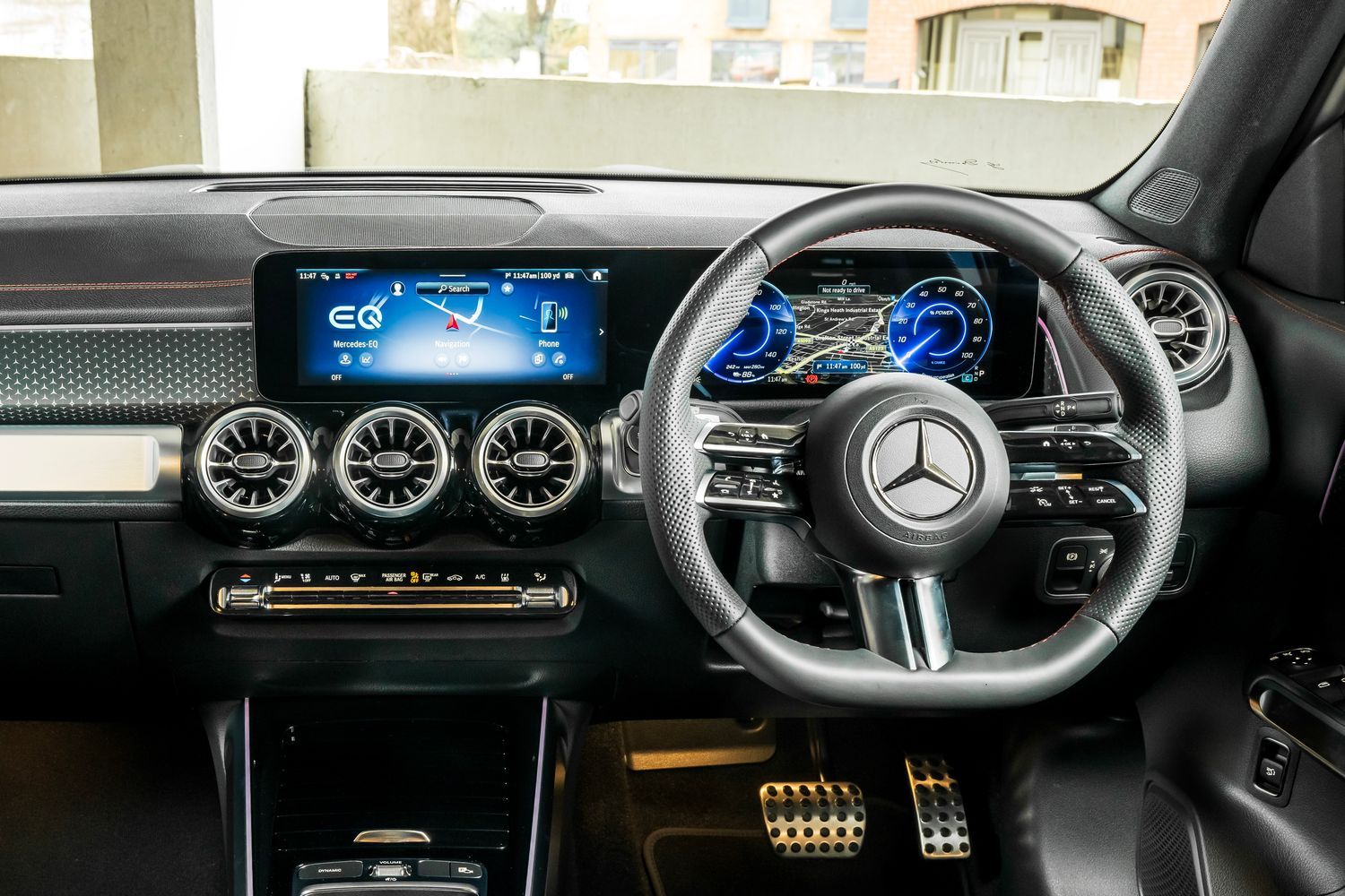 Mercedes-Benz EQB interior including infotainment displays, steering wheel and air vents.