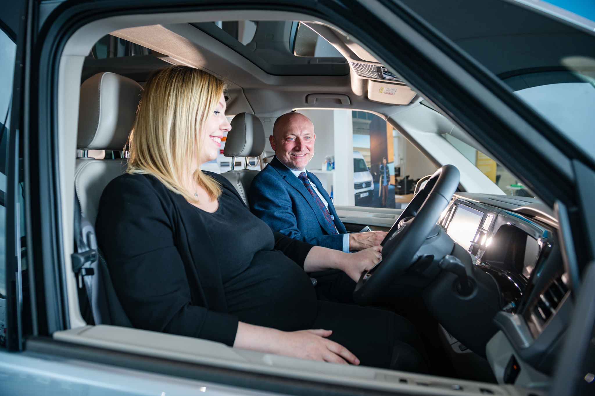 Agnew Sales Team exploring an Electric Car with customer