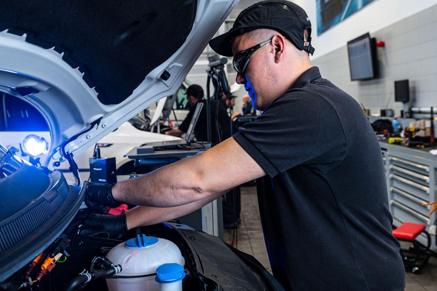 Volkswagen Commercial Vehicle Technician carrying out maintenance work