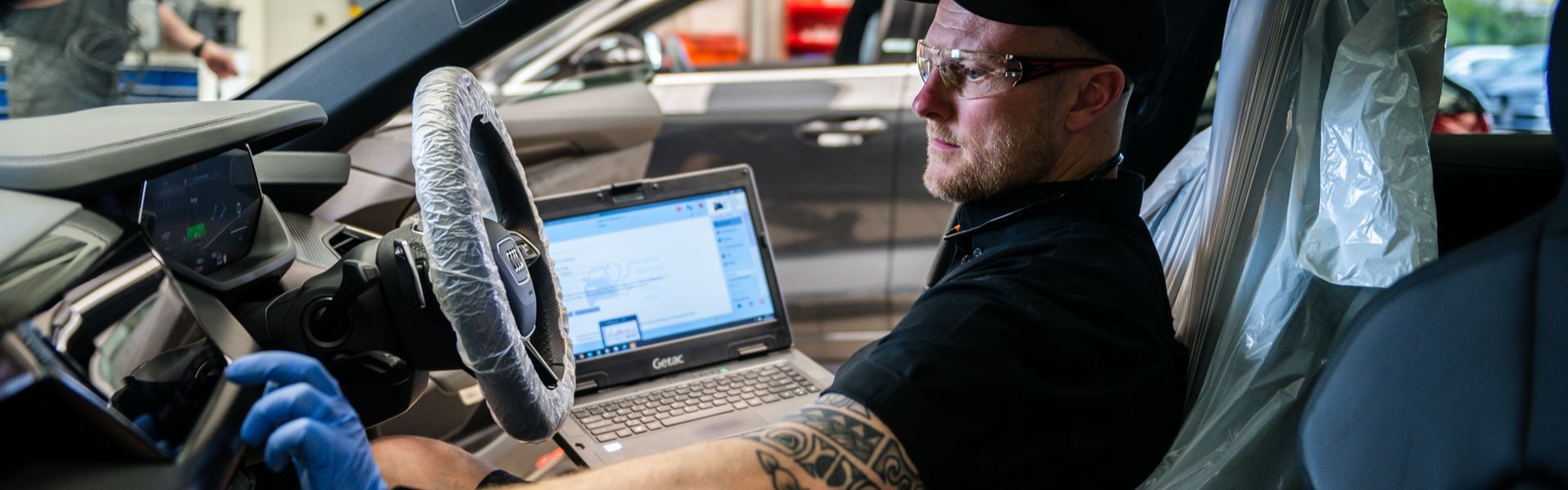 Audi Technician inspects Audi e-tron during service plan at Belfast Audi