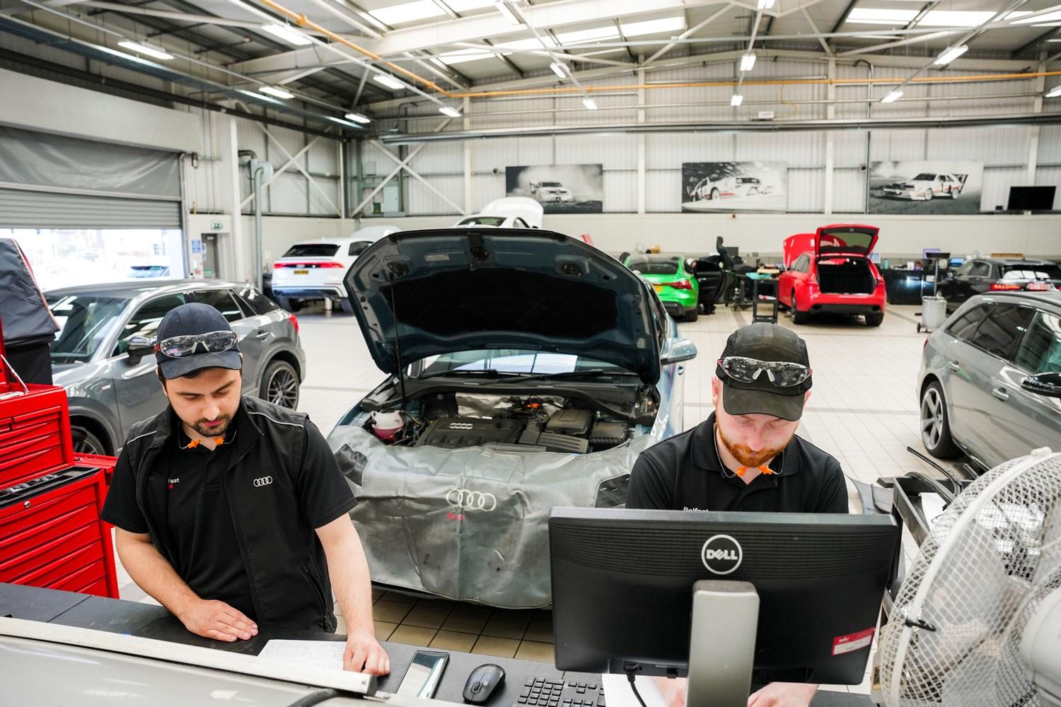 Two Audi Repair Specialists make notes during Audi Health Check at Belfast Audi