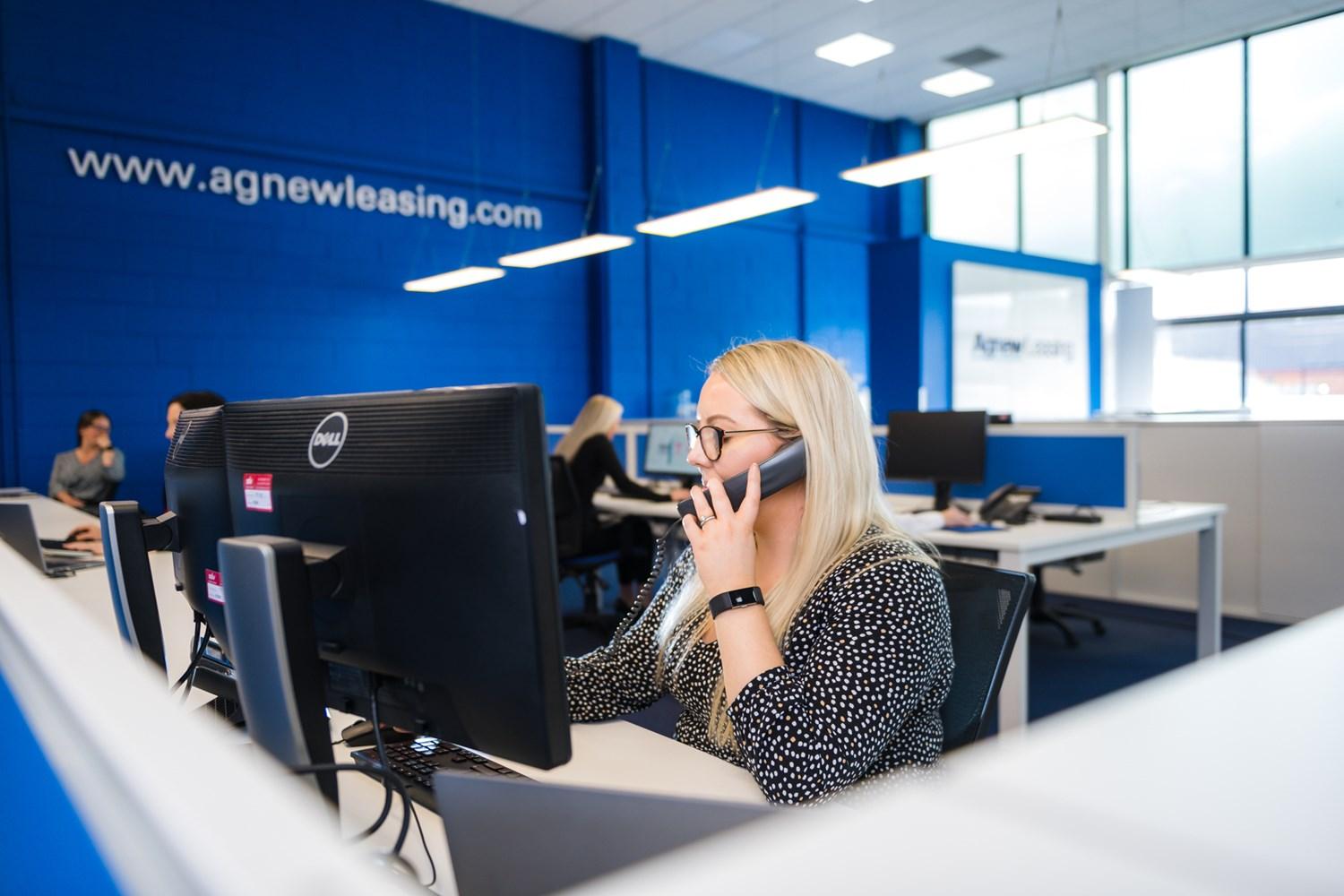 Agnew Leasing staff answering car leasing enquiries in Belfast