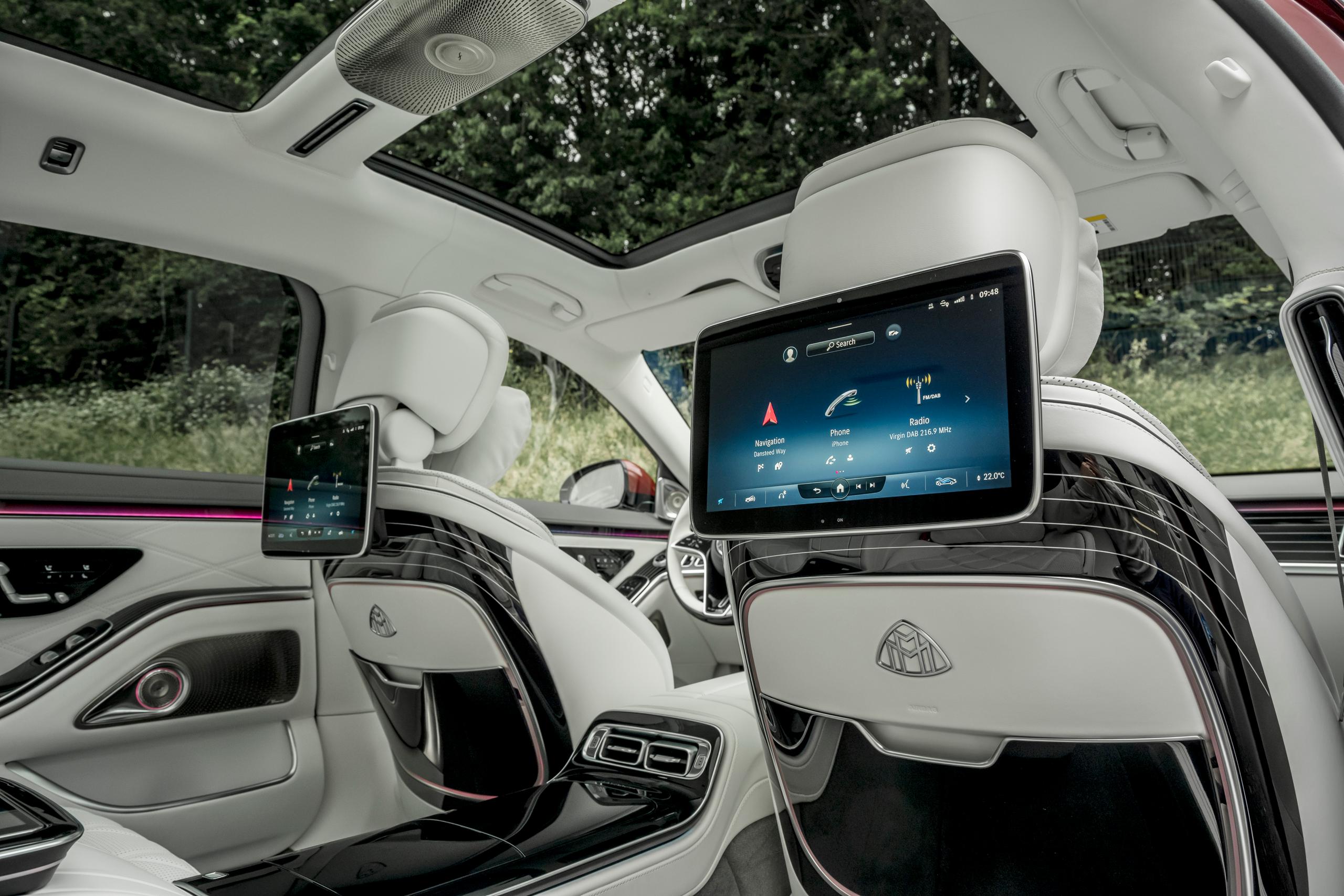 The back of the Mercedes-Maybach S-Class white interior seats with two MBUX Rear Tablets.