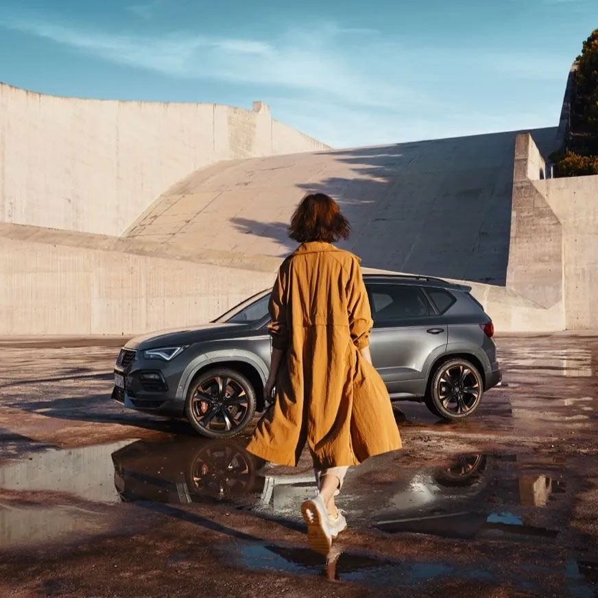 Woman near CUPRA model