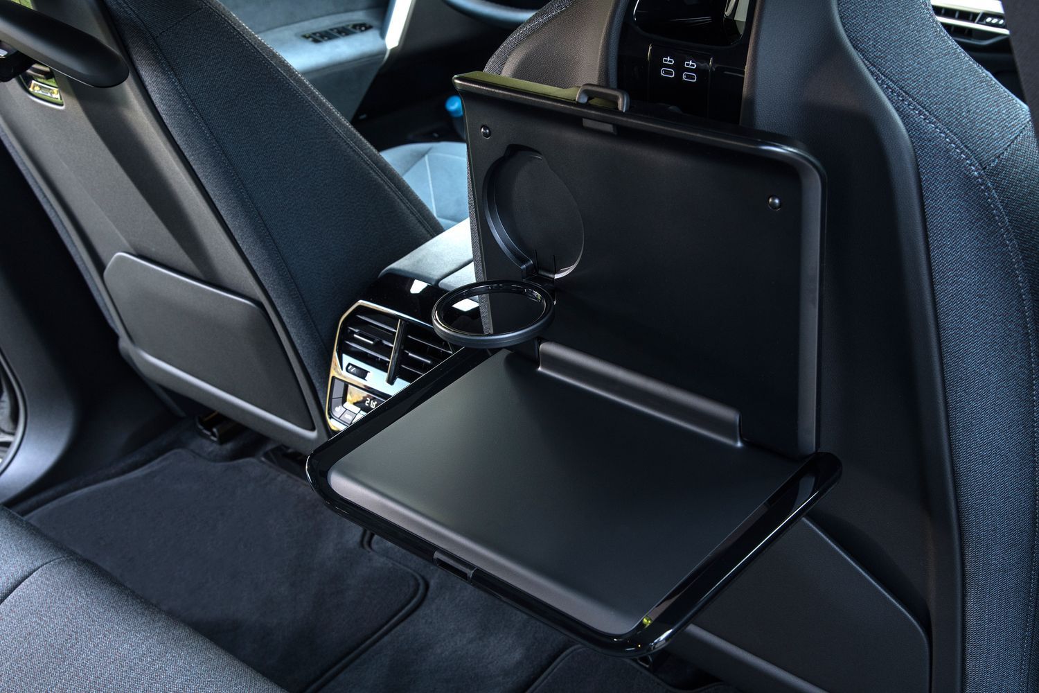 New BMW IX image of backseat drink holder and trays