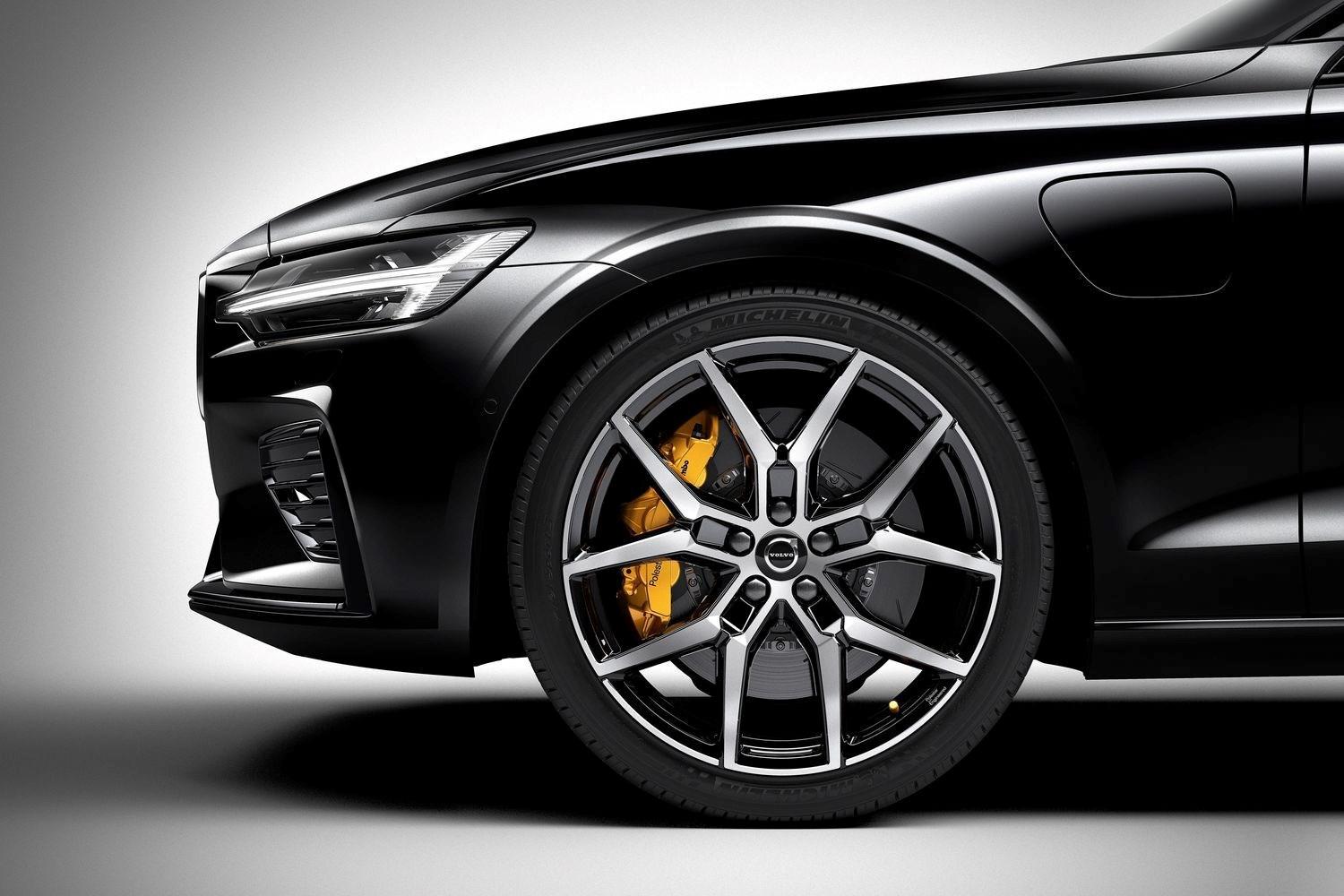Side view of black Volvo V90 with yellow brake disc