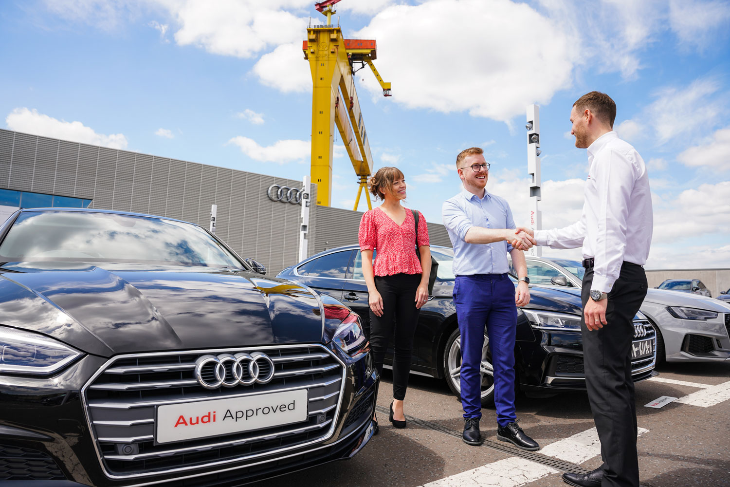 BMW Sales Advisor shakes the hand of customer at Belfast Audi after chatting about an Approved Used  Audi A3 Saloon