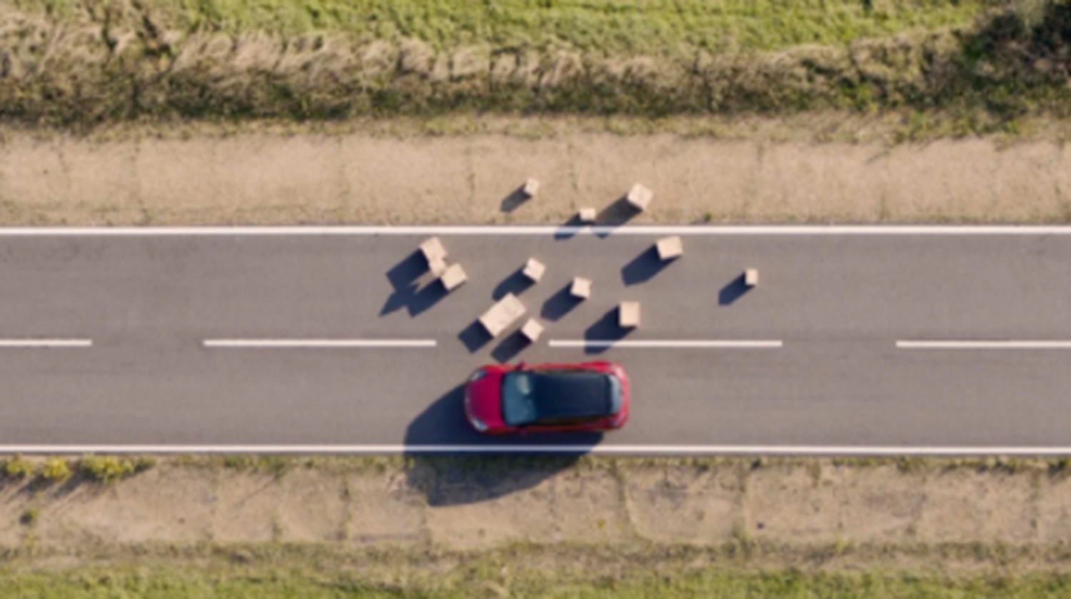 Top down view of Red Ford on road