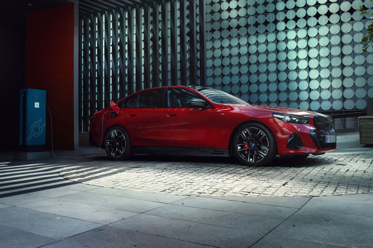 New BMW I5 image of vehicle parked showcasing its exterior sideview and sporty alloys