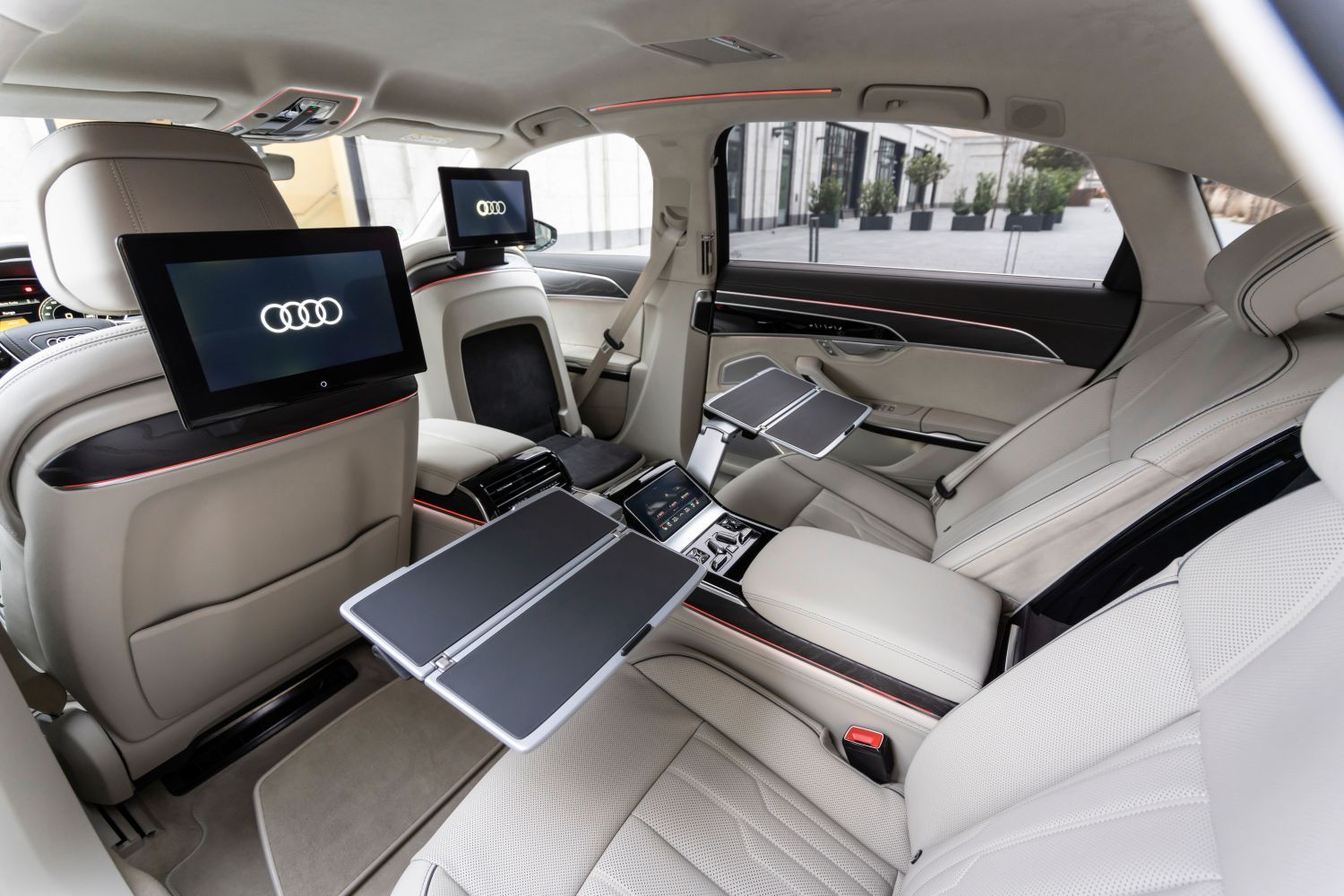 New A8 L TFSI e image of back seats with tv screens and trays presented