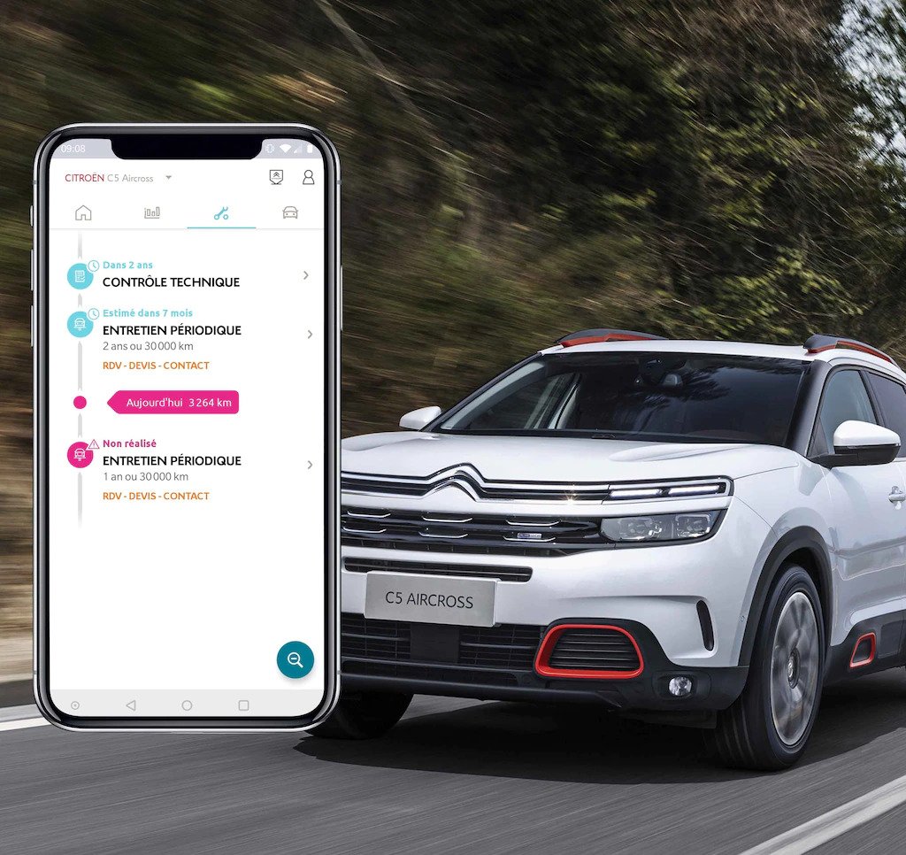 Example of Citroen MyApp on a smartphone with a Citroen driving in the background