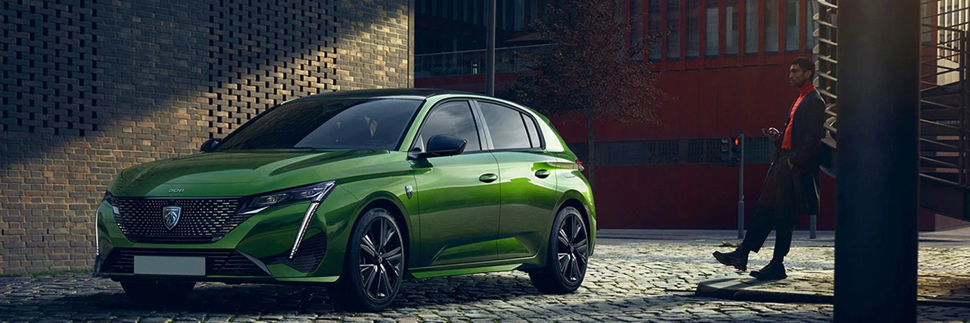 man beside Peugeot 308