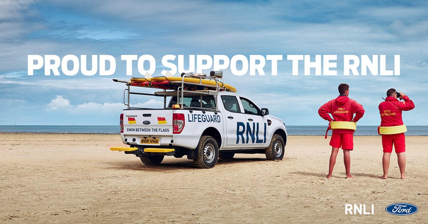 Proud to support RNLI Banner - Ford Ranger & Lifeguards on beach