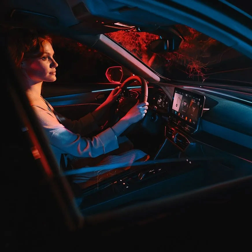 Woman driving CUPRA car