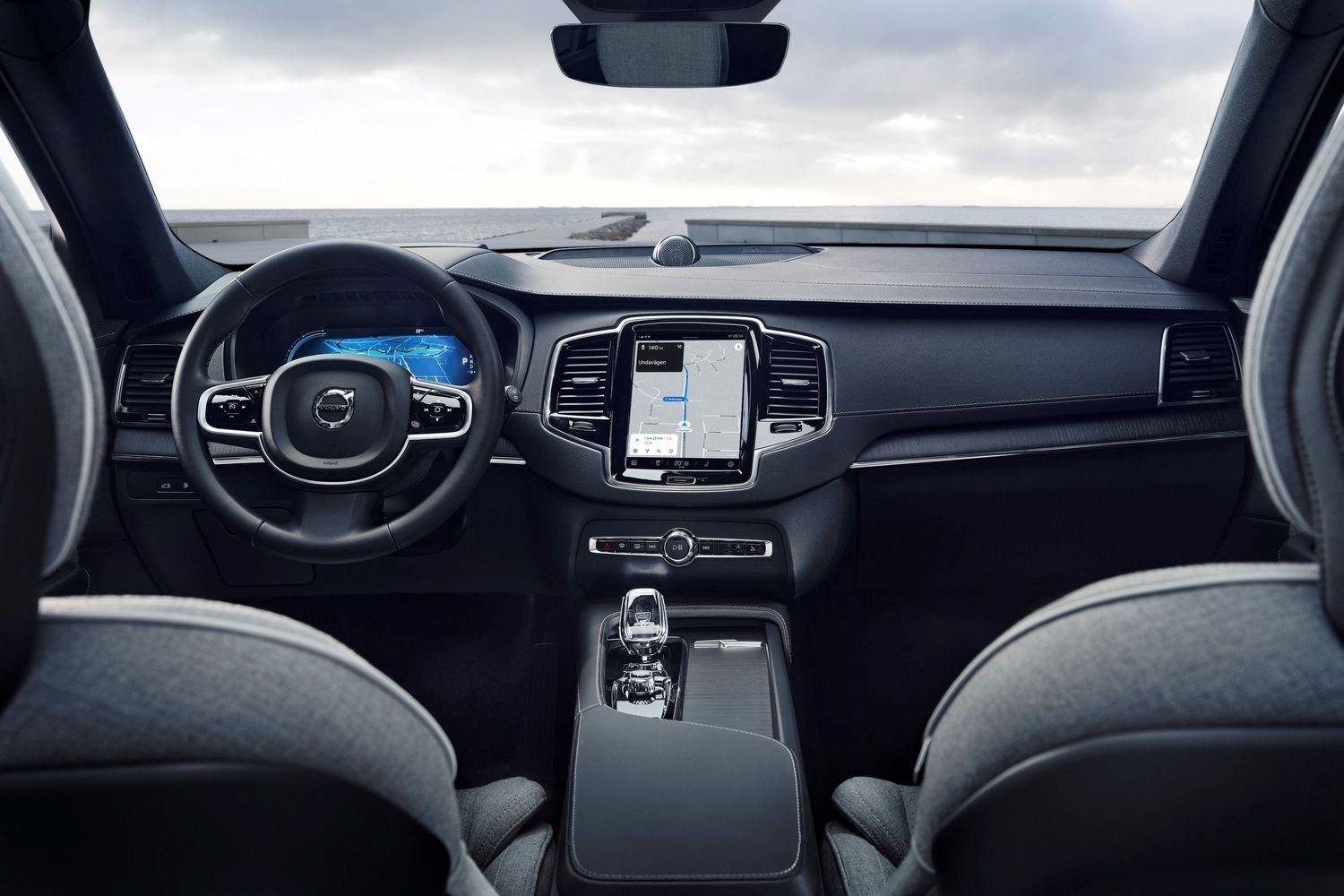 Interior of the new Volvo XC90 Recharge with focus on steering wheel and infotainment system