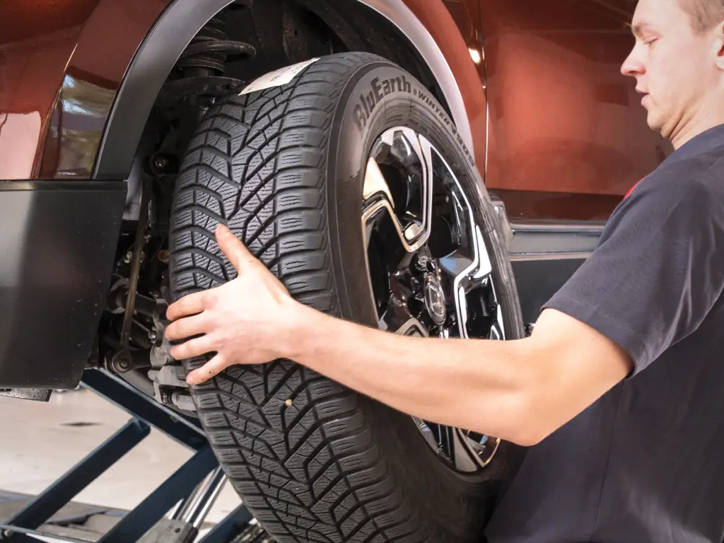 Wheel being removed from vehicle