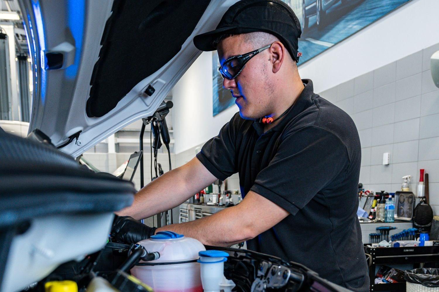 Volkswagen Commercial Vehicle Technician carrying out an interim service.