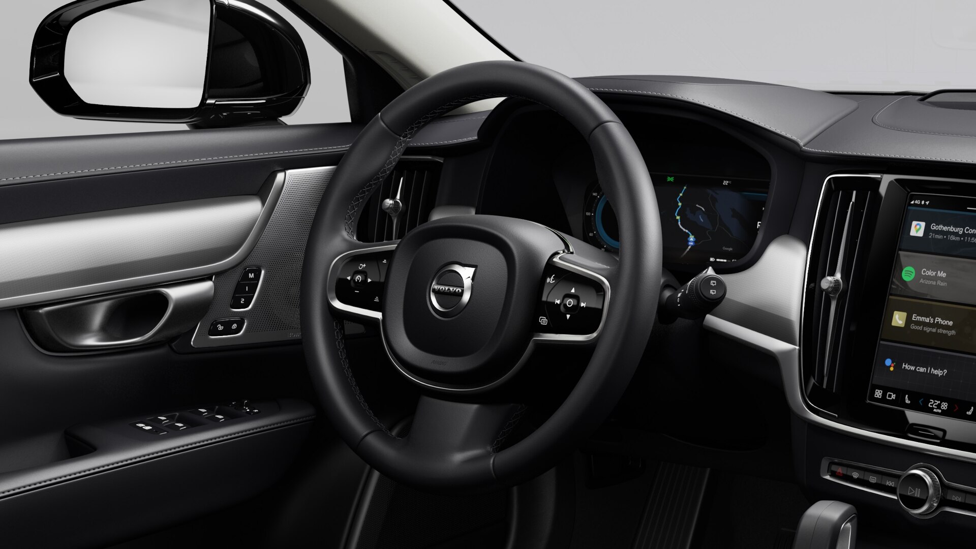 Close up of the Volvo V90 black leather steering wheel and driver display.