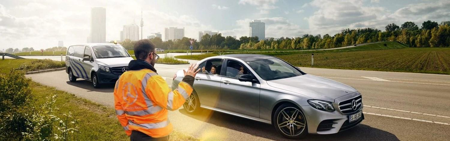 Mercedes-Benz Roadside Assistant waves goodbye to family in Mercedes-Benz C-Class who have had assistance.