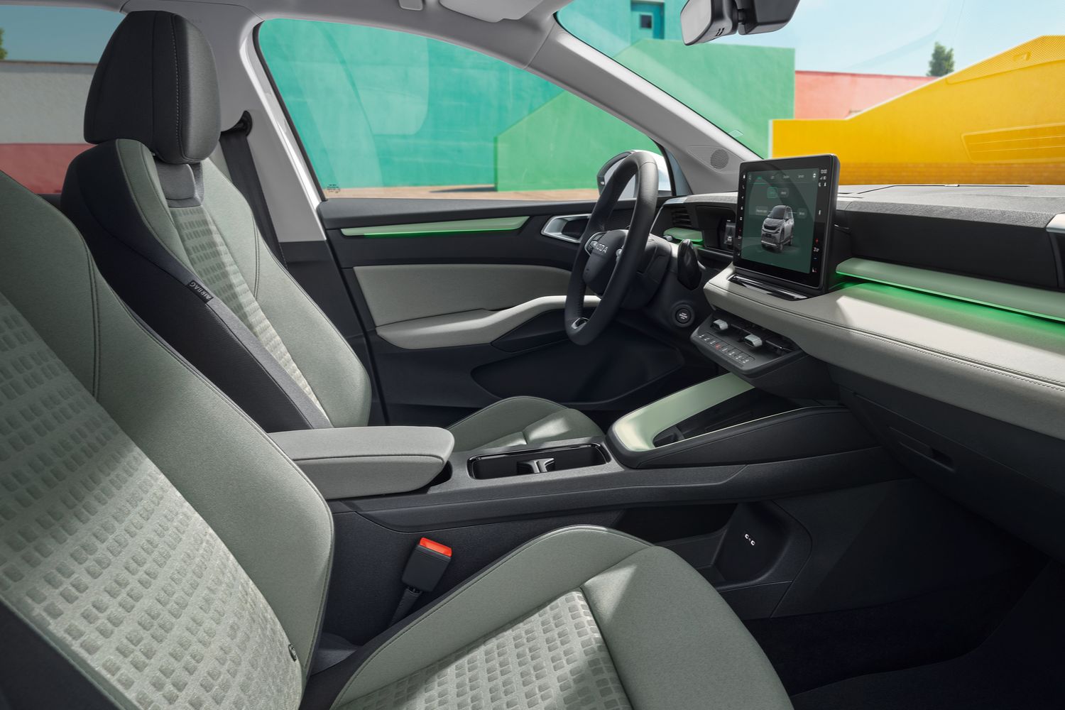 Interior view of the front passenger seats of the Skoda Epiq, featuring the flexible seating and storage layout.