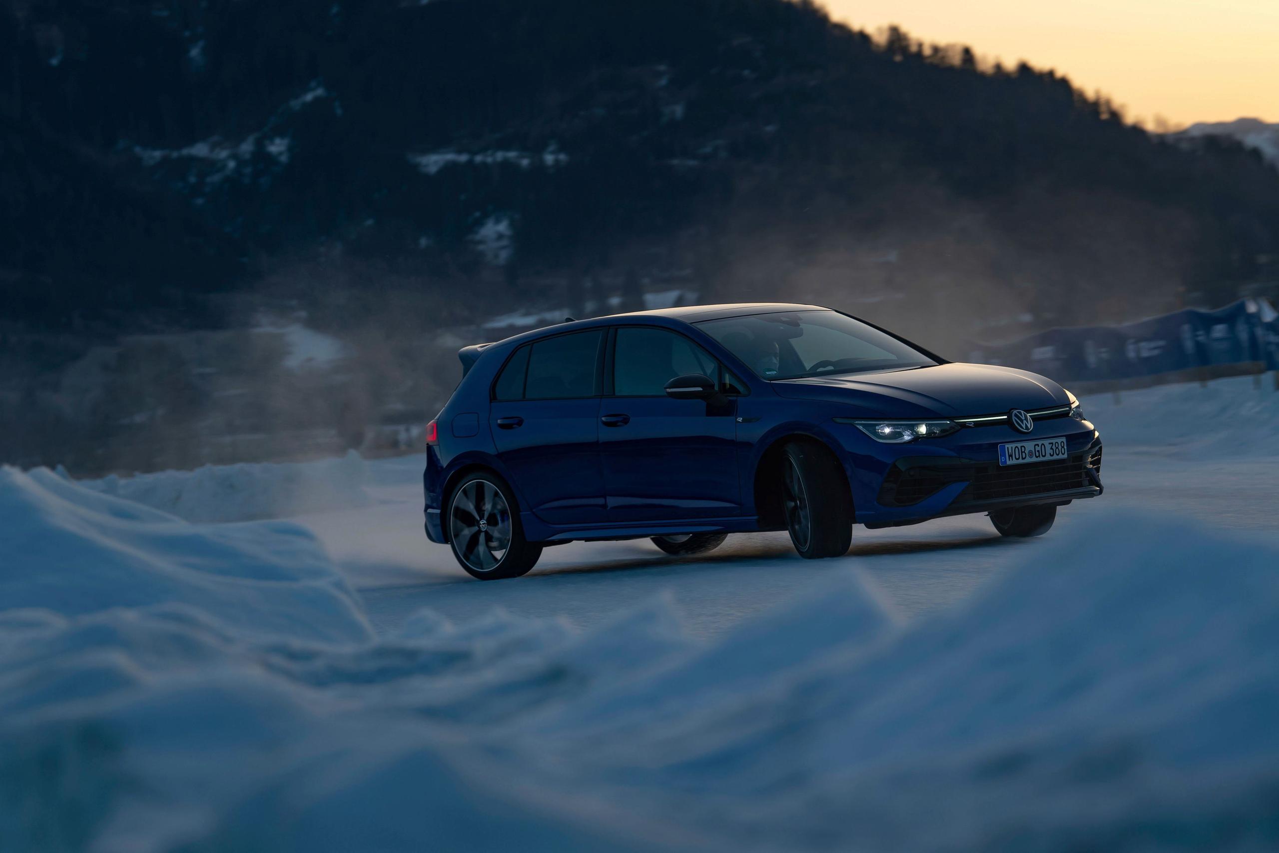 Volkswagen Golf driving in heavy snow