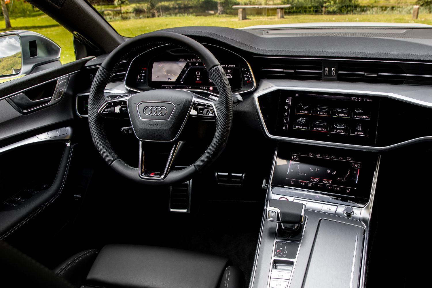 New Audi S7 Sportback image of front interior showcasing steering wheel and infotainment system