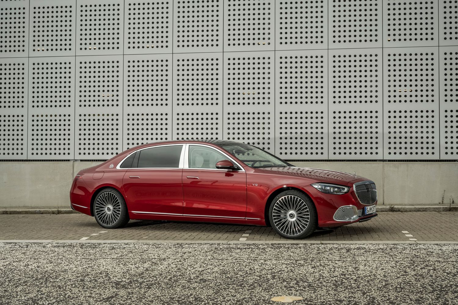 Side view of a red Mercedes-Maybach S-Class.