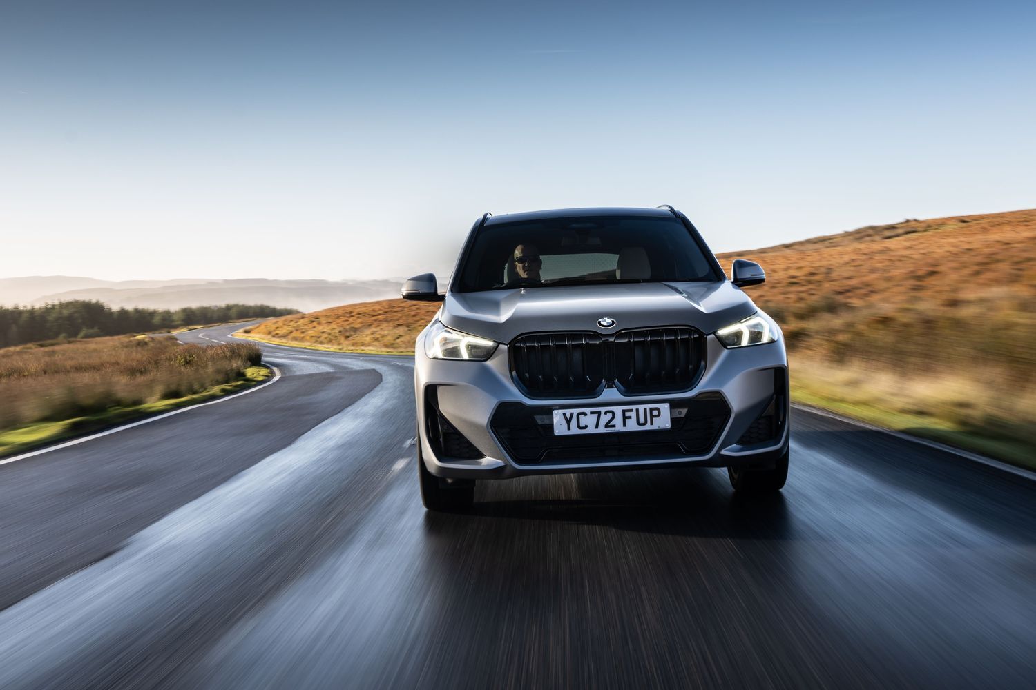 New BMW X1 view of vehicle driving, front view