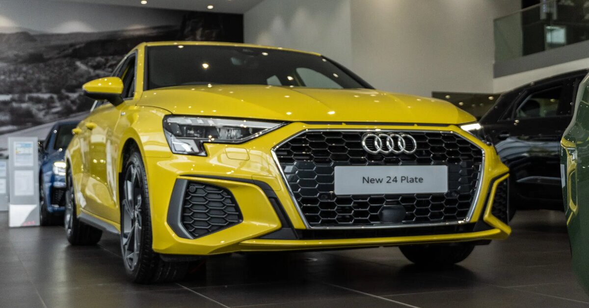 Audi A3 parked in dealership showroom