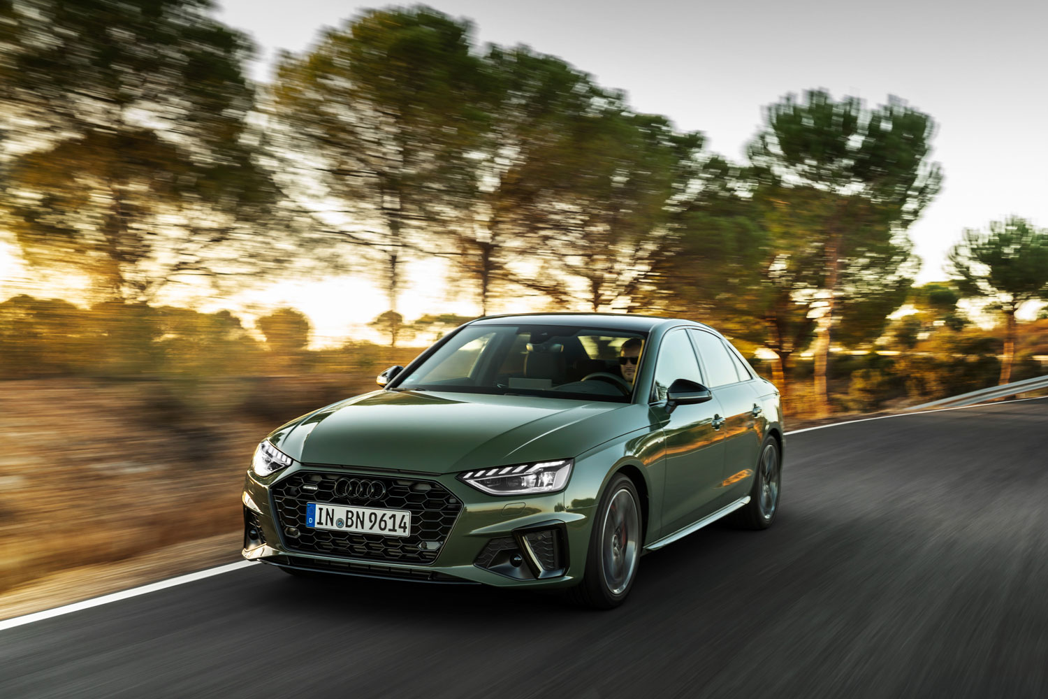 Image of new Audi A4 Saloon in green driving.