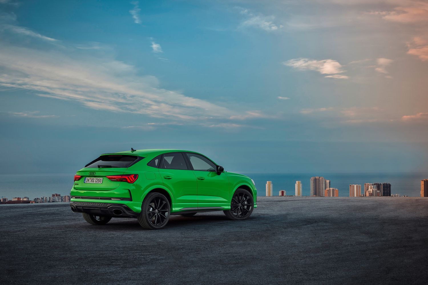 New Audi RS Q3 Sportback in green view from behind of vehicle parked