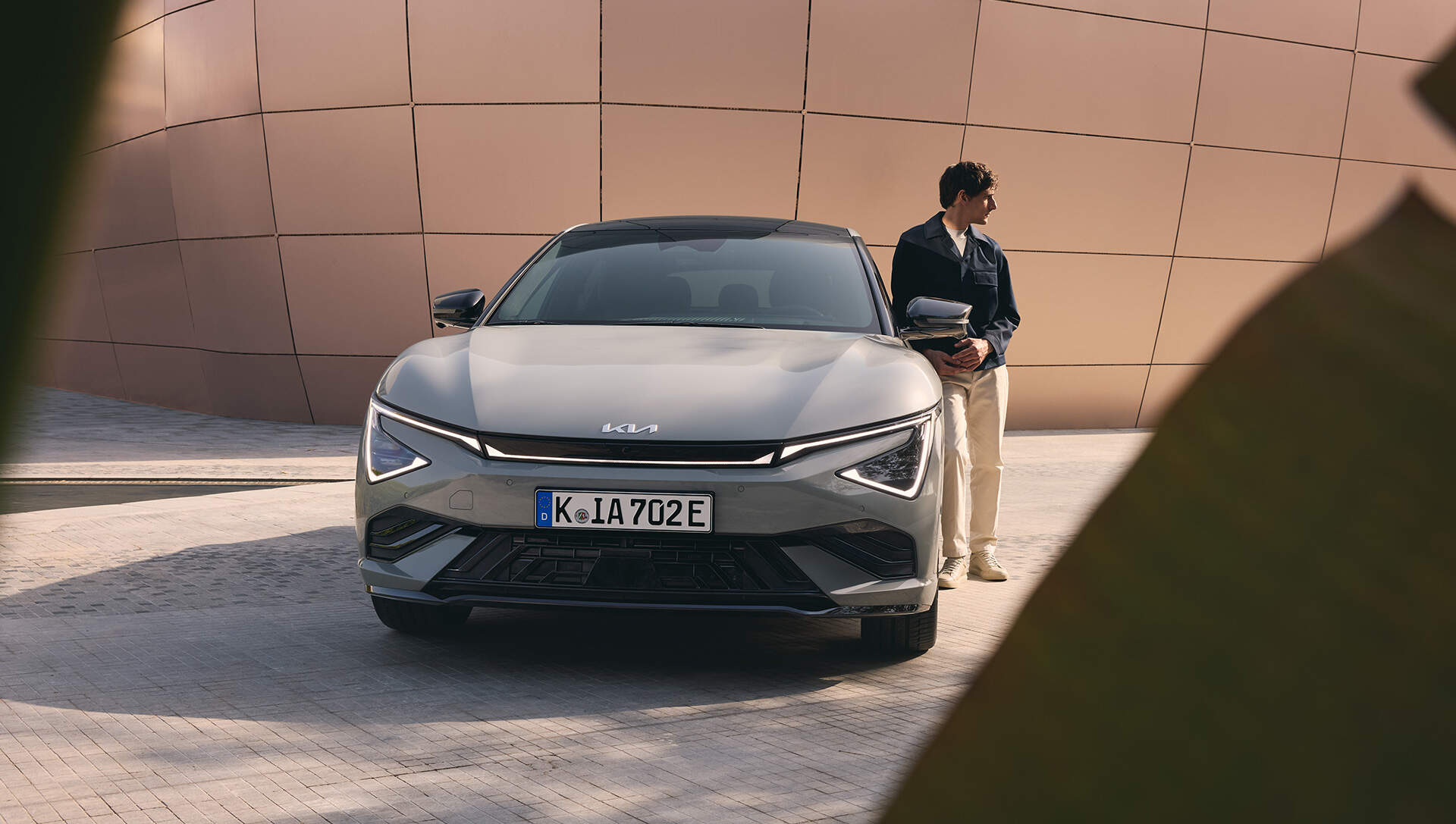 man beside a kia EV6