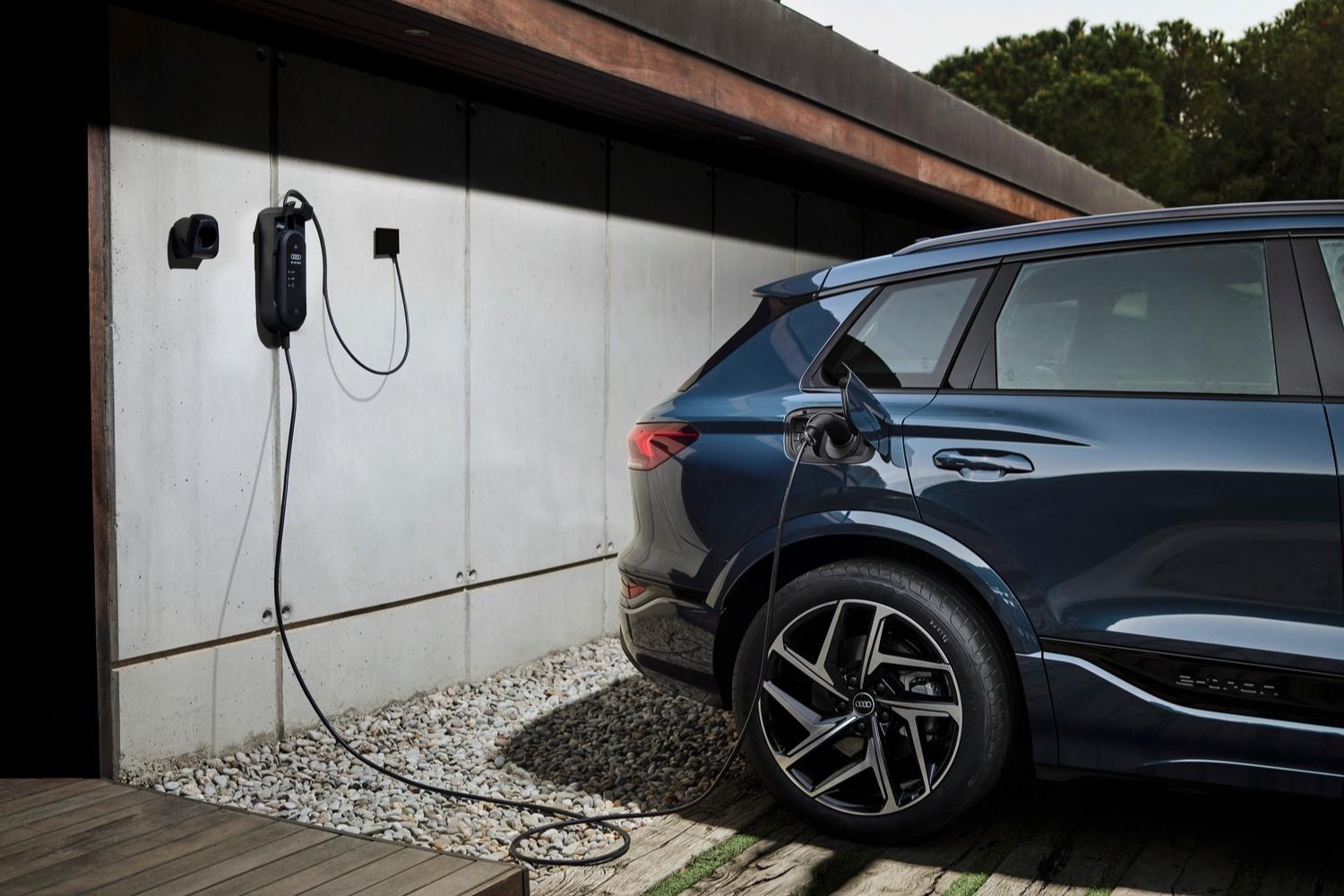 Electric Audi charging at the charging port.
